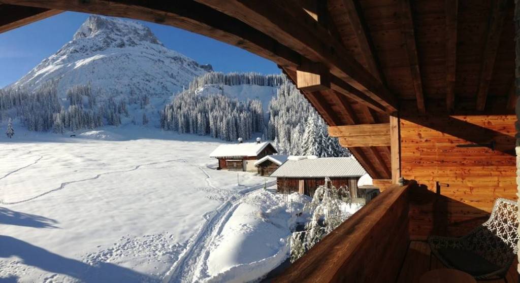 View of the snow-covered landscape on the Arlberg from the terrace at Lech Lodge